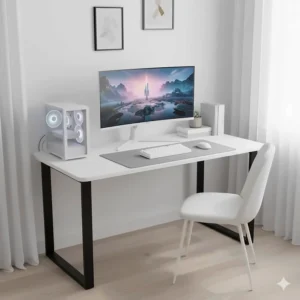 Minimalist white gaming desk styled with a PC tower and gaming peripherals in a bright room.