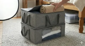 Alt text for image 6: Two grey fabric under bed storage boxes shallow enough for stacking, showing a space-efficient way to organise seasonal clothing in a small flat or bedroom.