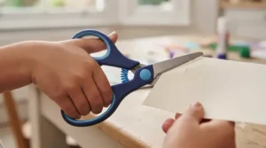 Toddler training craft scissors with a self-opening spring for early years development.