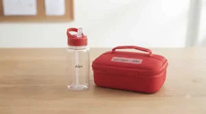 Brightly coloured, named water bottle and insulated lunch bag for starting primary school.