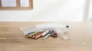 Child-friendly grip pencils, blunt-ended scissors, and a glue stick for starting school activities.