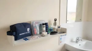 Washbag and bathroom toiletries essentials for shared student accommodation facilities.