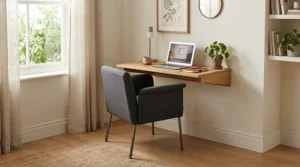 A study chair for small bedroom use with foldaway arms that slide under the desk surface